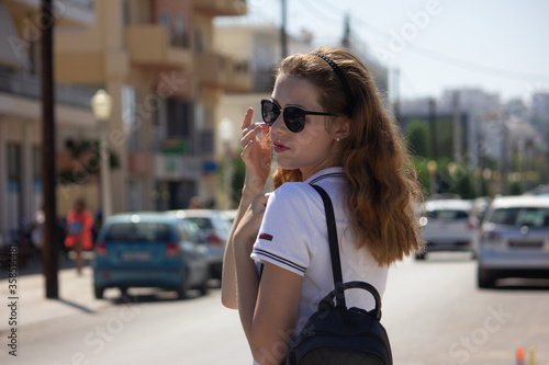 Rhodes, Greece - 06/07/2018: A marine stewardess in uniform is looking into the camra. Workers of the yacht (crew).