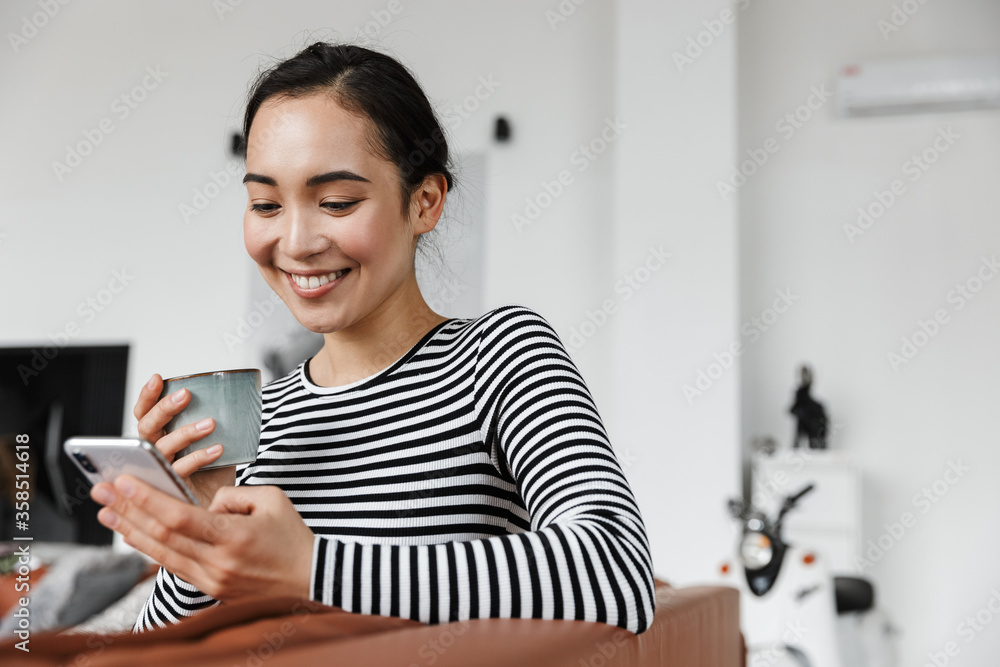 Attractive smiling young asian woman wearing casual clothes Attractive smiling young asian woman wearing casual clothes