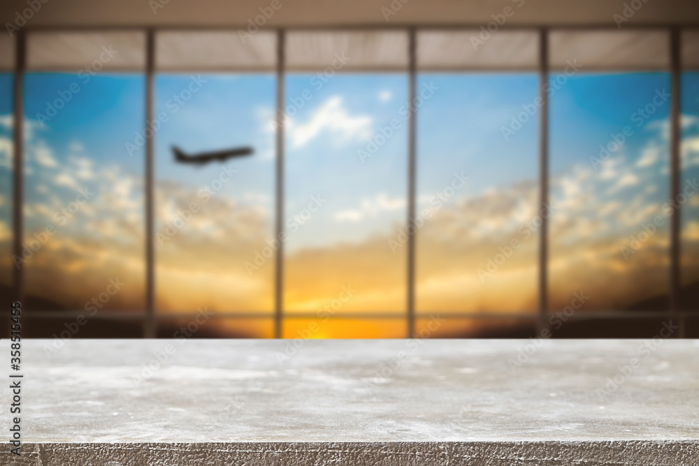 Fototapeta premium Empty wooden table space platform and Airport background for product display montage.
