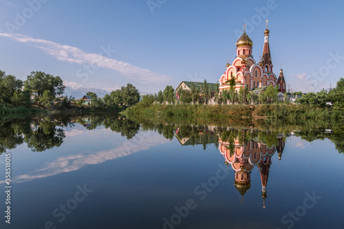 Reflection of  Russian orthodox church known as Church of exaltation of the holy cross, in Almaty, Kazakhstan photo