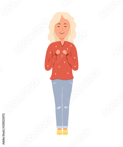 Happy girl presses her hands against her chest