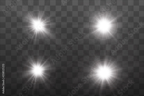 Set of golden glowing lights effects existing on a transparent background.