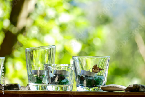 glass of water on wooden table, digital photo picture as a background , taken in bled lake area, slovenia, europe photo