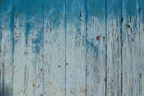 Aged Natural Old Blue Color Obsolete Wooden Board Background. Grungy Vintage Wooden Surface. Painted Obsolete Weathered Texture Of Fence.