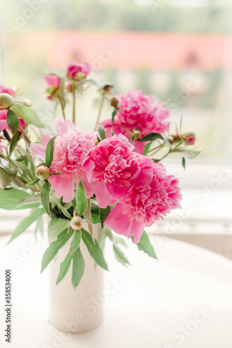bouquet of pink peonies on a table
