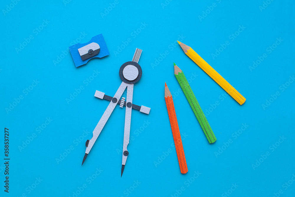 Back to school. Tools. Handmade paper art and cutout. Set of pencils, sharpener and compass. Back to school. Tools. Handmade paper art and cutout. Set of pencils, sharpener and compass.