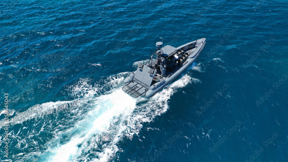 Obraz premium Aerial drone photo of luxury inflatable speed boat cruising in deep blue Aegean sea, Mykonos island, Cyclades, Greece