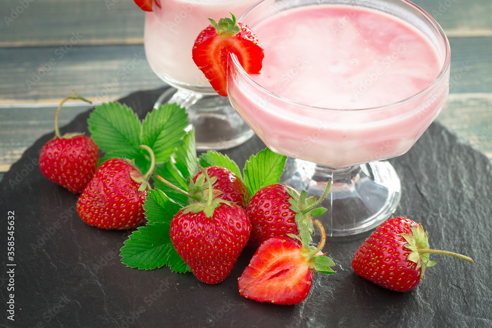 Ripe, fresh strawberries in a bowl on an old background. Ripe, fresh strawberries in a bowl on an old background.