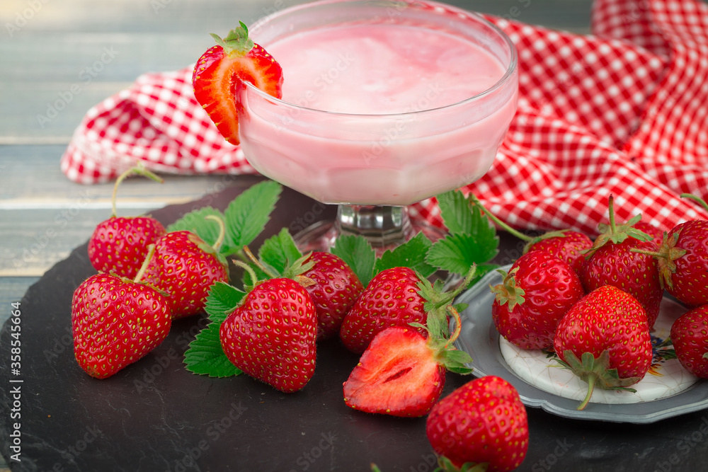 Sweet strawberry and healthy, wholesome food in composition on the table. Sweet strawberry and healthy, wholesome food in composition on the table.