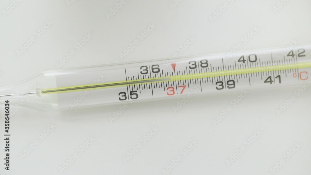 Glass mercurial thermometer on white background Glass mercurial thermometer on white background