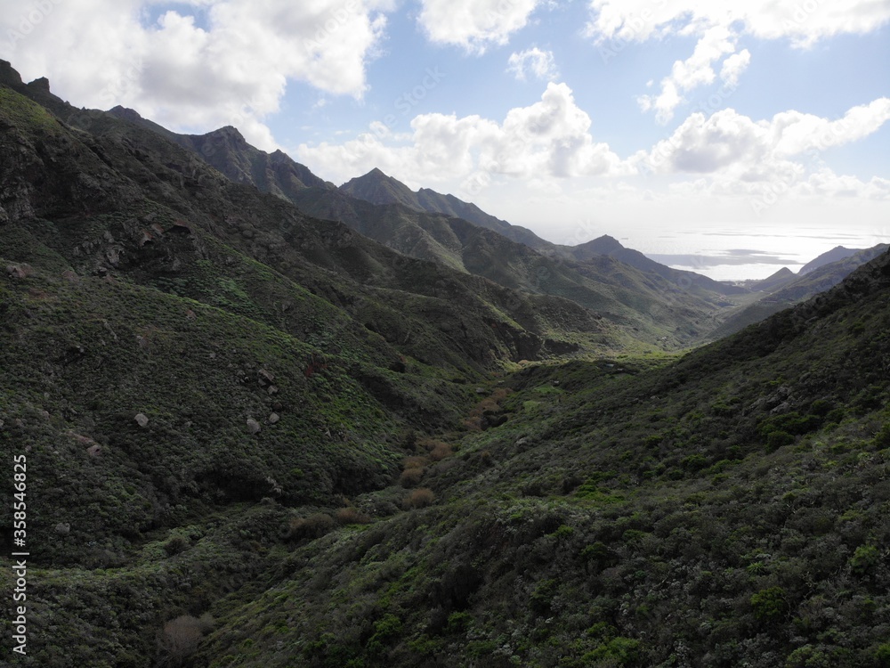 valley of the island with jungles and hills photographed from the air