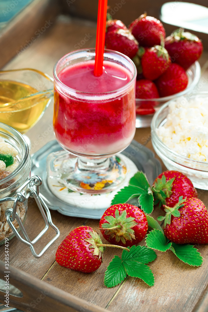 Fruit cocktail from fresh strawberries on the kitchen table. Fruit cocktail from fresh strawberries on the kitchen table.