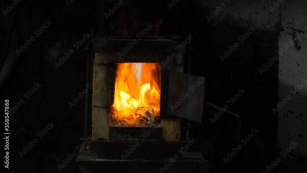 Homemade Furnace with Gas Flame in Smithy. Preparing for Blacksmithing Homemade Furnace with Gas Flame in Smithy. Preparing for Blacksmithing