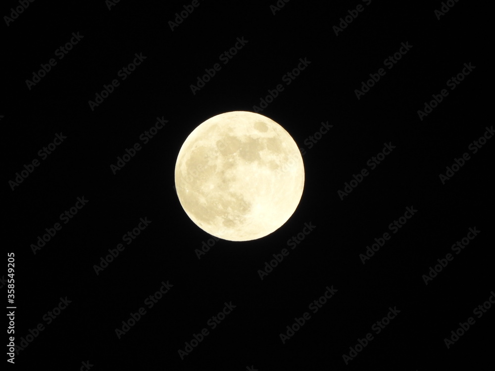 Fototapeta premium Full moon in dark background.