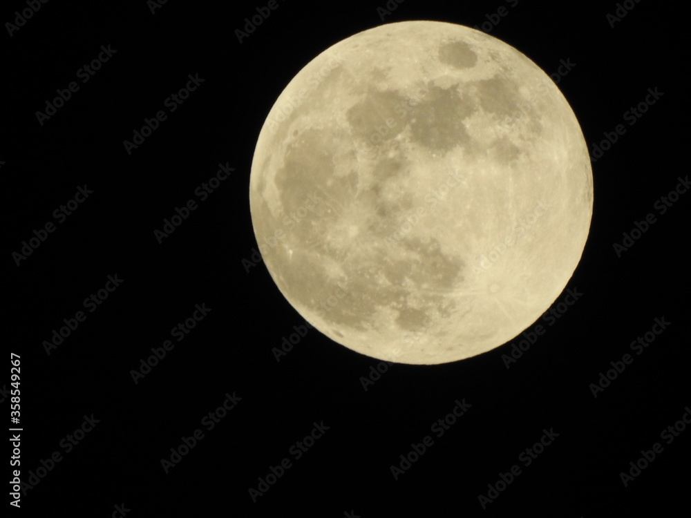 Full moon in dark black background. Full moon in dark black background.