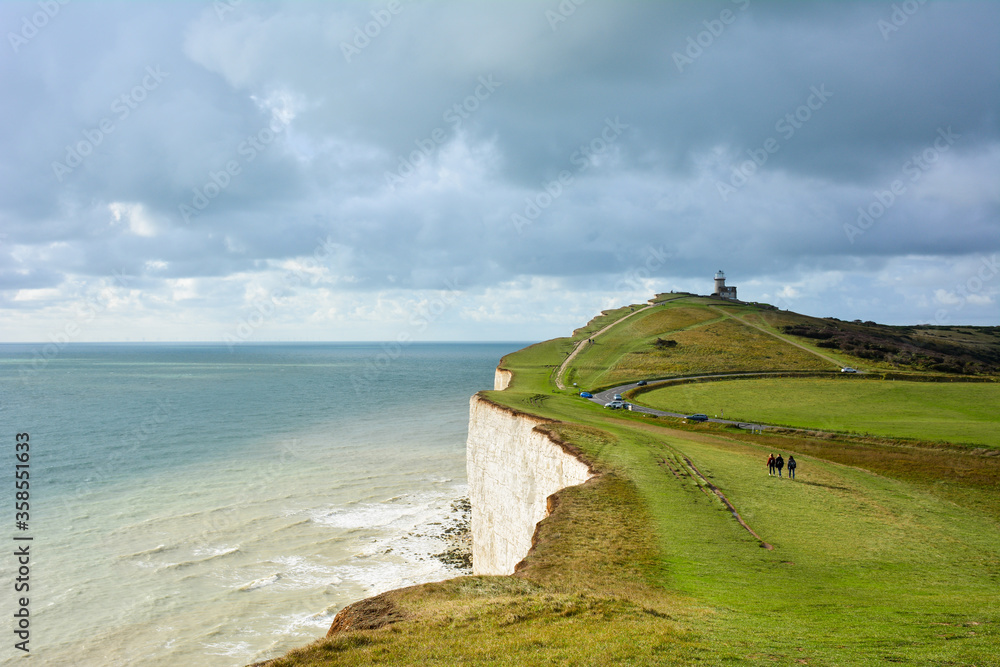View of Birling Gap and cliffs in the South Downs national park on a cloudy day. The white cliffs of East Sussex, South East England, including Seven Sisters, are one of the landmarks of the UK