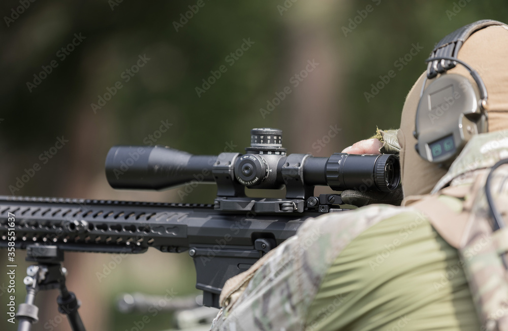Military man in camouflage uniform with rifle. Military man in camouflage uniform with rifle.