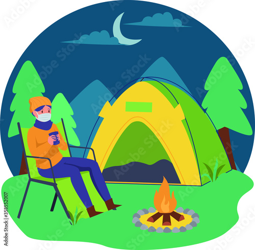 A man enjoying hot drink while camping alone