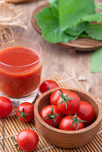Tomato juice. Tomato juice on wooden background.