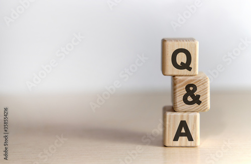 Questions and answer - text on wooden cubes, on White background