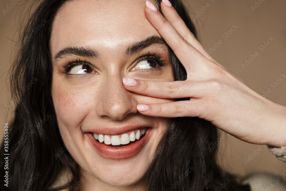 Fototapeta premium Photo closeup of happy brunette cute woman laughing and looking upward