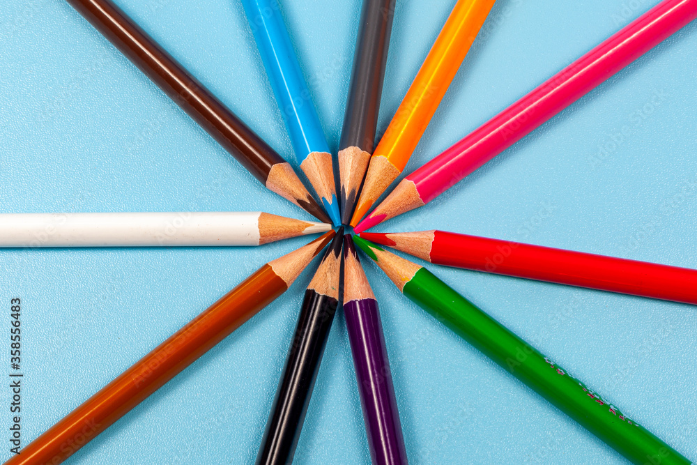 Fototapeta premium colored pencils isolated on blue background