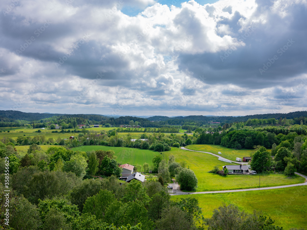 Rural landscape in western Sweden with distant Atlantic ocean. Fields and scattered trees Rural landscape in western Sweden with distant Atlantic ocean. Fields and scattered trees