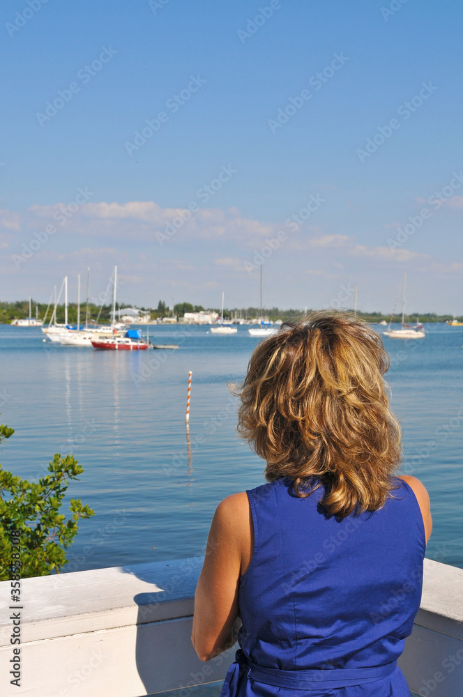 Beautiful Woman Looking at Sailboats