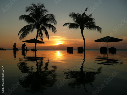 Sunset framed by palm trees