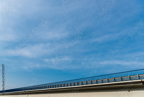 low angle view of bridge against sky with clouds