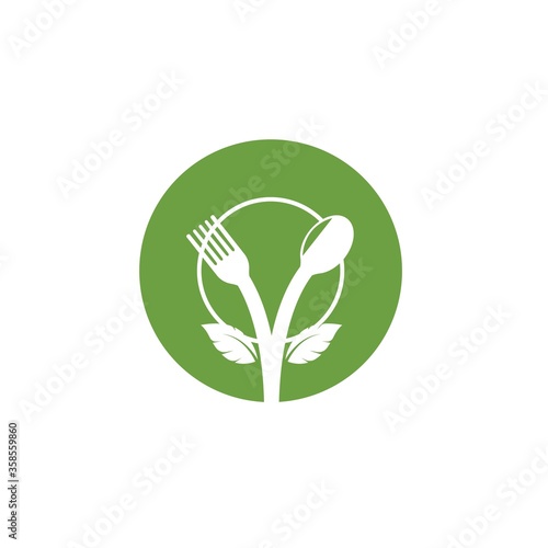 fork and spoon with leaves icon of vegetarian food vector