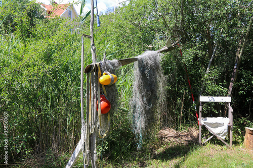Fishing net hanging to dry on land