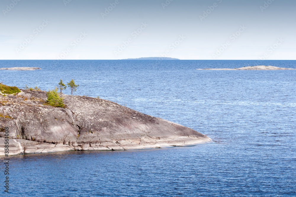 Beauty rocky island on the lake.