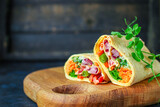 wrap tortilla or burrito stuffing vegetables vegetarian pita bread raw fish seafood in ice quick freeze Menu concept serving size. food background top view copy space for text organic healthy eating 