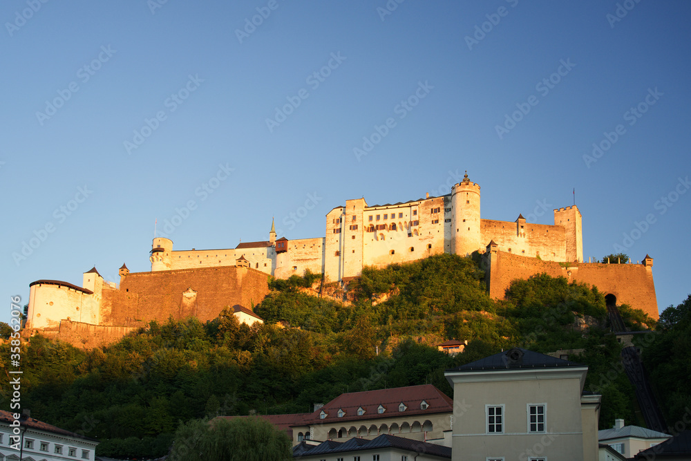 Salzburg Castle in Austria on a rock in the evening
