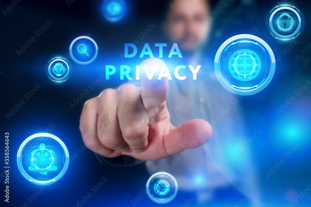 Business, Technology, Internet and network concept. Young businessman working on a virtual screen of the future and sees the inscription: Data privacy Business, Technology, Internet and network concept. Young businessman working on a virtual screen of the future and sees the inscription: Data privacy