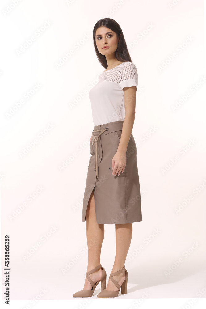Indian business woman executive posing in formal split skirt and t-shirt high heels sandals Indian business woman executive posing in formal split skirt and t-shirt high heels sandals