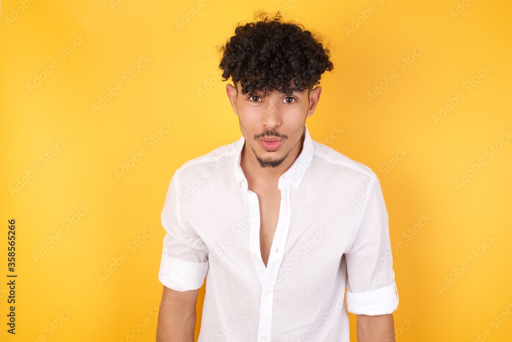 Attractive young man having stunned and shocked look, with mouth open and jaw dropped, listening to friend's story in full disbelief, exclaiming: Wow, I can't believe this. Surprised boy. Shock Attractive young man having stunned and shocked look, with mouth open and jaw dropped, listening to friend's story in full disbelief, exclaiming: Wow, I can't believe this. Surprised boy. Shock