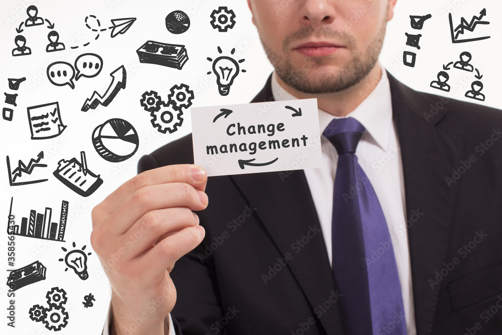 Business, technology, internet and network concept. Young businessman thinks over the steps for successful growth: Change management Business, technology, internet and network concept. Young businessman thinks over the steps for successful growth: Change management