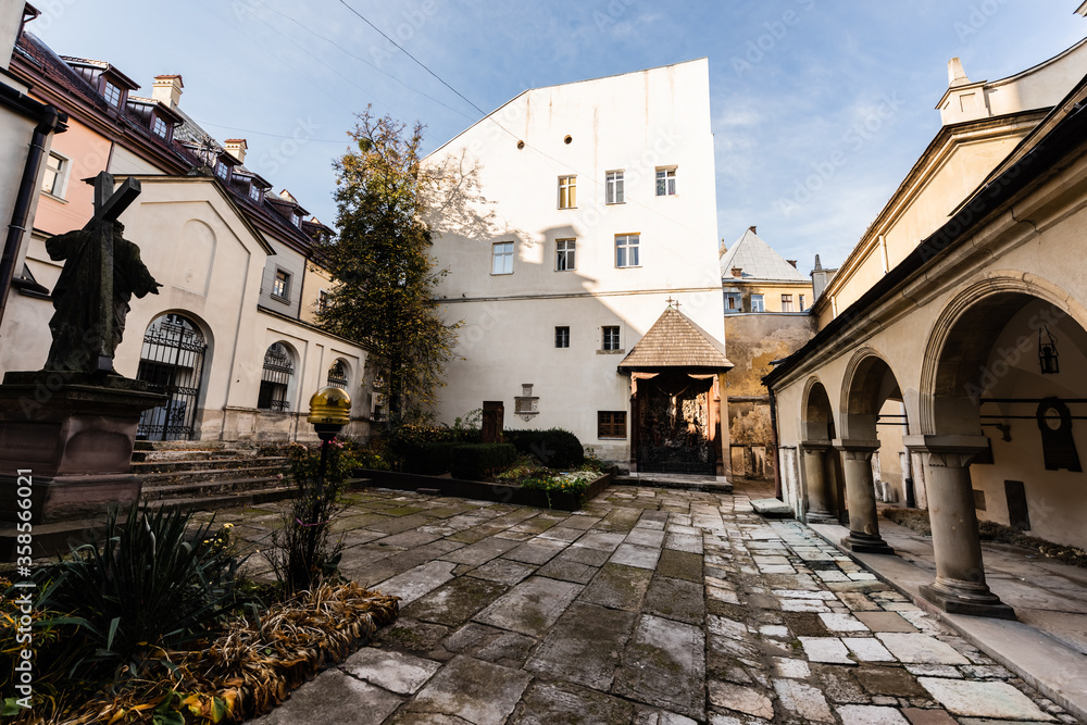 inner yard of carmelite monastery with arch gallery in lviv, ukraine