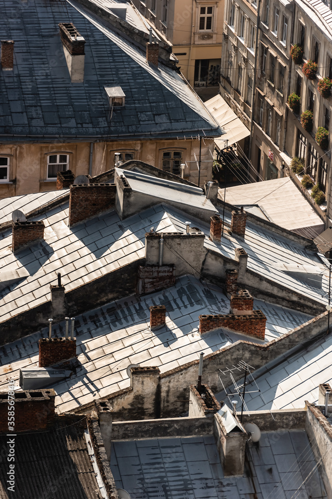 aerial view of old houses with rusty metallic roofs in historical center of lviv, ukraine aerial view of old houses with rusty metallic roofs in historical center of lviv, ukraine