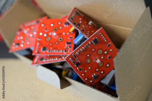 Close up of electrical circuit boards boxed in factory