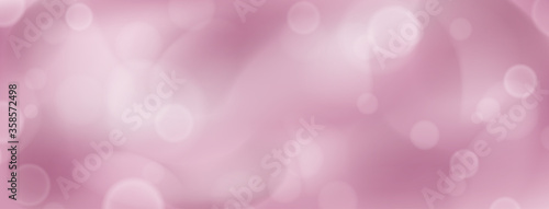Abstract background with bokeh effects in pink colors