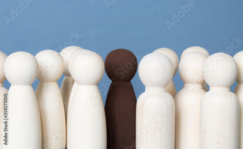 Black Lives Matter concept with black person amongst white people representing diversity and equality in the community with copy space