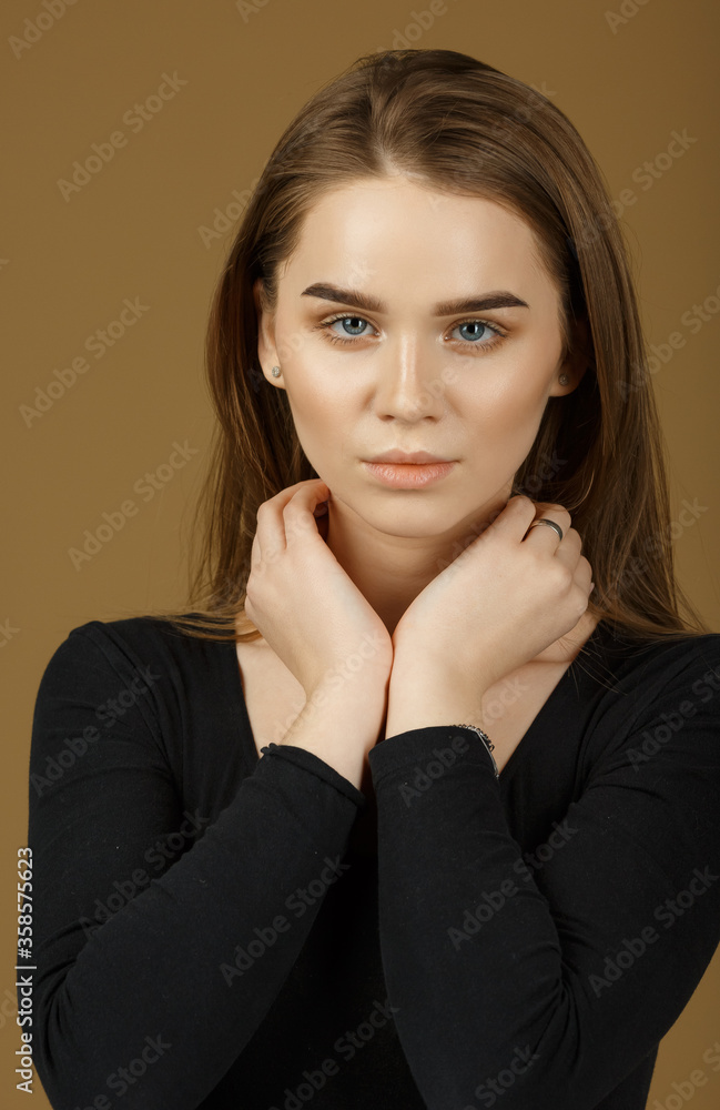 Retouched beauty studio Portrait of a red-haired Caucasian girl with long straight hair, with bright makeup and beautiful eyes. Healthy skin. Retouched beauty studio Portrait of a red-haired Caucasian girl with long straight hair, with bright makeup and beautiful eyes. Healthy skin.