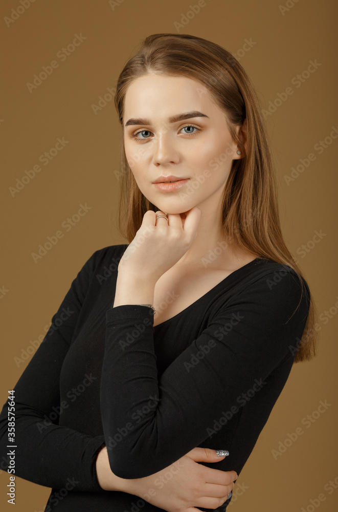 Young red-haired woman with beautiful hair and perfect skin. Beautiful model with a long, thick, straight hairstyle Young red-haired woman with beautiful hair and perfect skin. Beautiful model with a long, thick, straight hairstyle