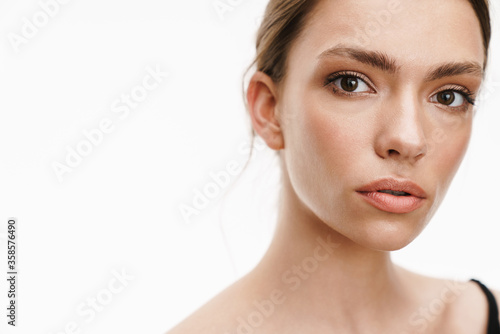 Image of beautiful caucasian young brunette woman standing isolated