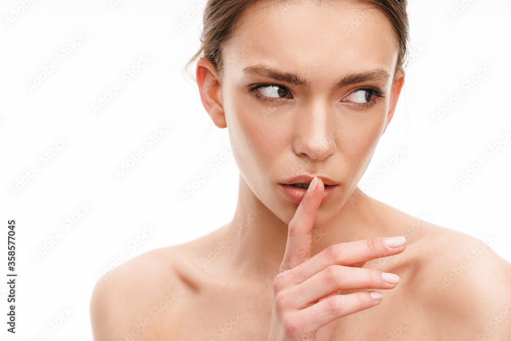 Image of beautiful brunette shirtless woman showing silence gesture Image of beautiful brunette shirtless woman showing silence gesture