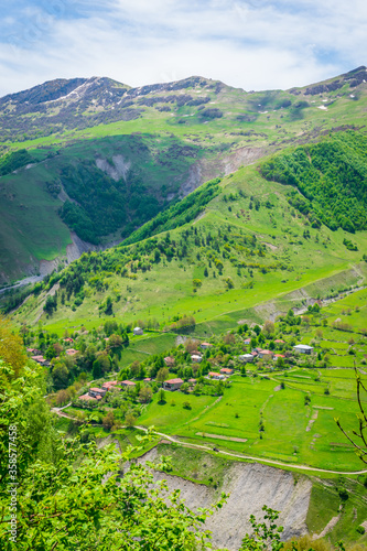 Village in Zemo mlieta with green nature around. Countryside of KAzbegi national park. Remore areas and small villages in caucasus.2020