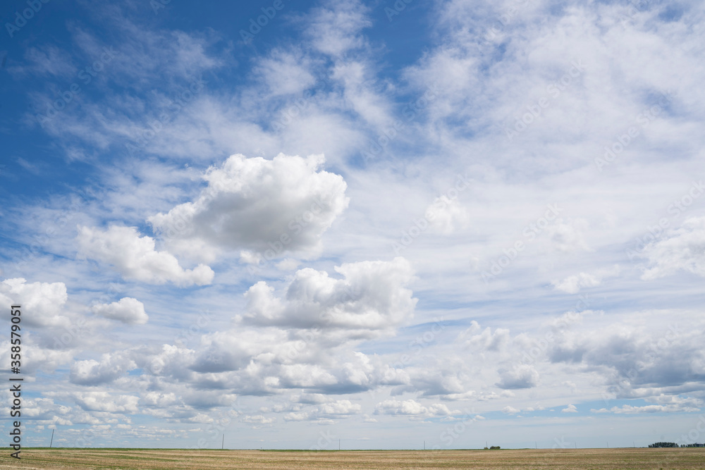 A landscape picture on the Canadian Prairies as farmers seed their crops in Rockyview County under a dramatic cloudy sky. A landscape picture on the Canadian Prairies as farmers seed their crops in Rockyview County under a dramatic cloudy sky.